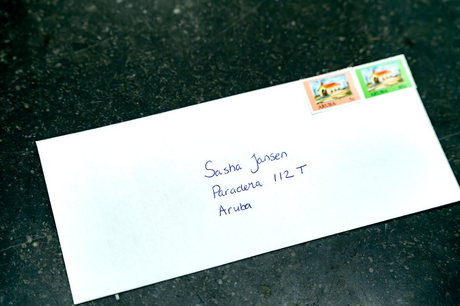 Envelope addressed to a Post Aruba customer